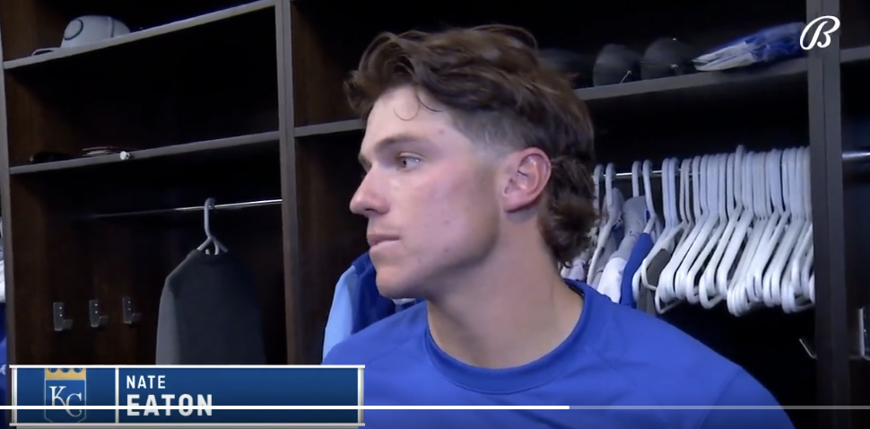 Nate Eaton stands in front of his locker looking forlorn.