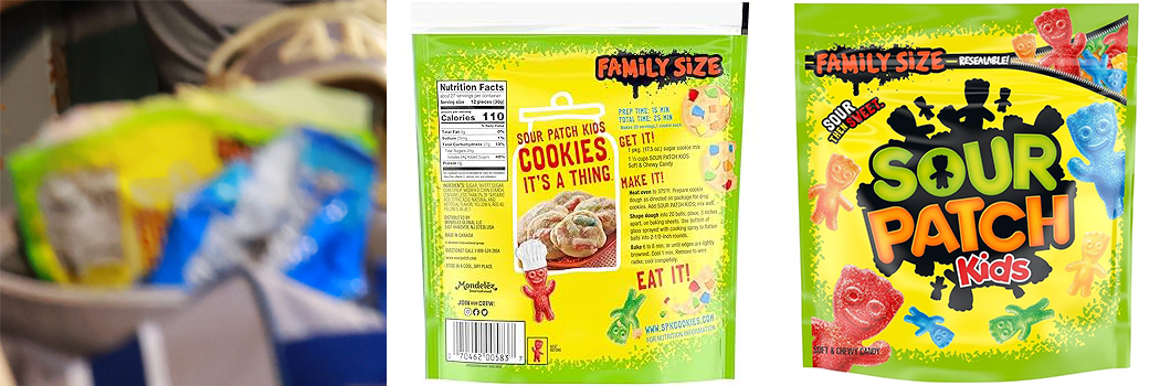 A zoomed in shot of the previously described picture. It's just a blurry yellow rectangle with green and black markings. But it's next to pictures of the front and back of a family size bag of Sour Patch Kids. The markings match up perfectly.